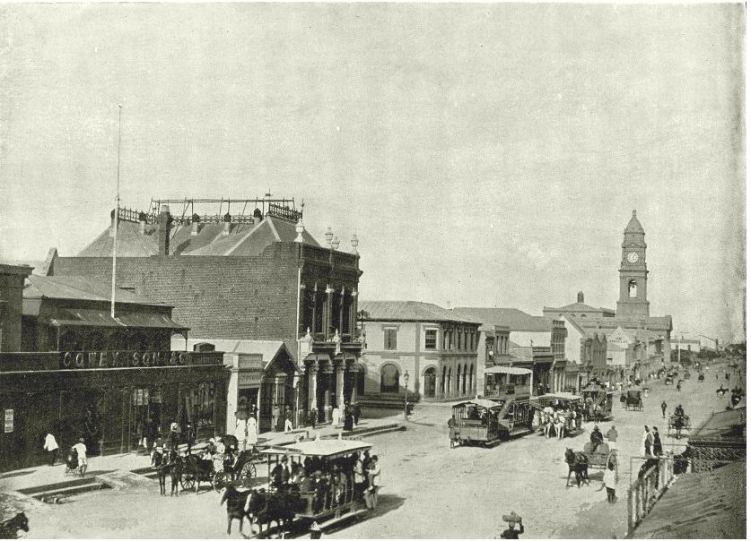 Looking east up West Street, Durban with the Town Hall  in the distance. Note the Bus of Cowey, SAon and Co, owned by William Cowey, William Richard Cowey & Clement Francis Davis. Bus dissolved in 1885