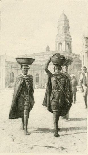 Two Zulu women in front of the Durban Town Hall, intersection of West and Gardiner Streets