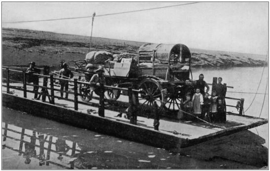 Wagon on a pontoon with Boer family